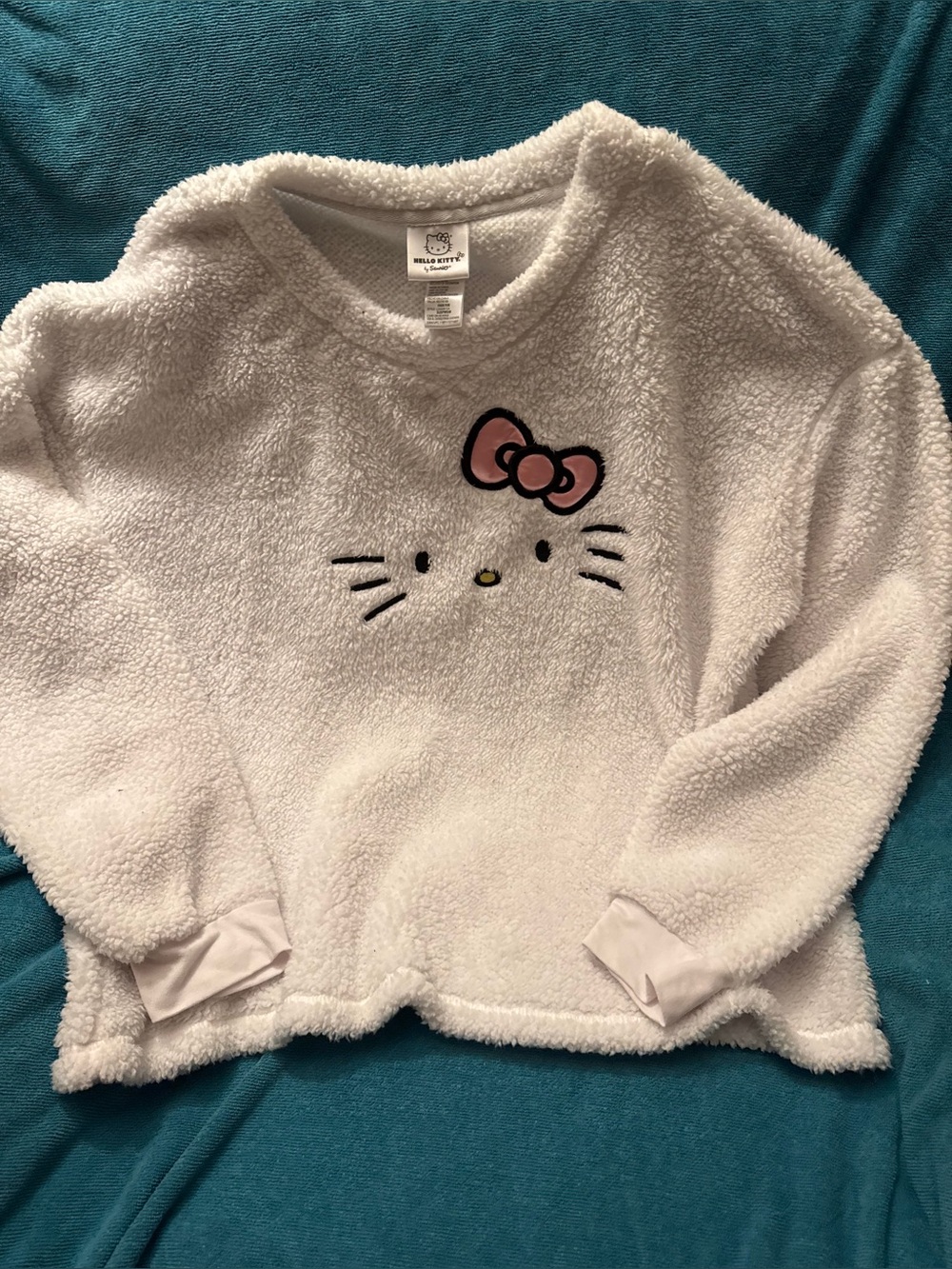 Sanrio Hello Kitty Plush Sherpa Top in White with Pink Bow